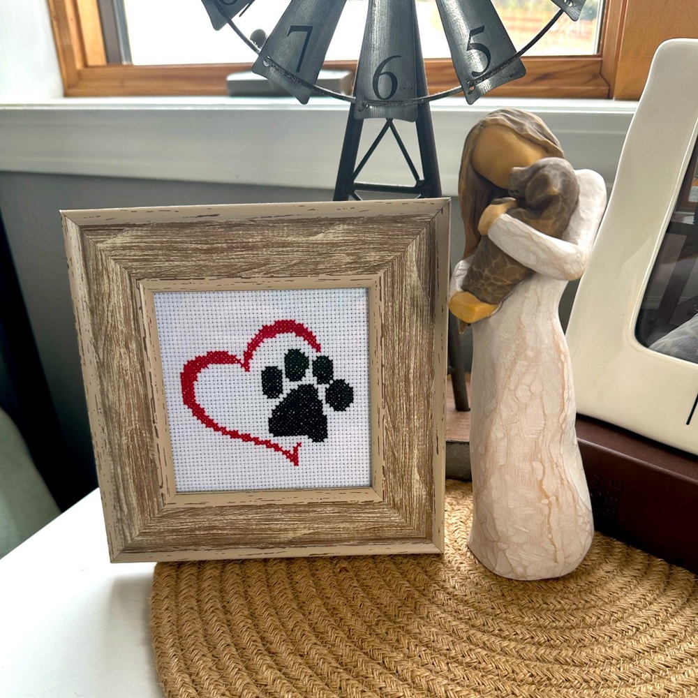 Framed dog paw cross stitch
